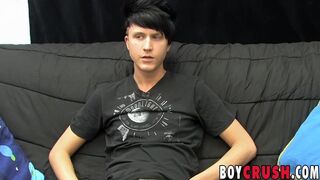 Young gay man jerks off his giant dick during an interview