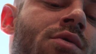 Muscular leather bear pulling his hard cock