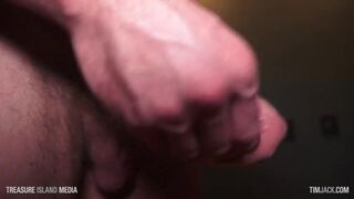 Jerking off a muscle stud while he tweaks his big nips