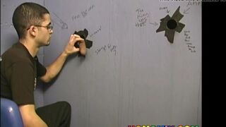 Thin gay white guy sucking off black cocks at a gloryhole