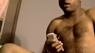 Black amateur working on his dick and making it cum