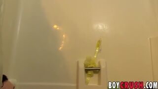 Good looking twink plays with his dick in the shower solo